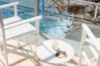 two chairs and a engagement ring sitting on a table at Hotel Bellevue Dubrovnik in Dubrovnik