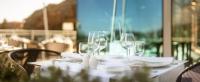 a table with wine glasses and napkins on it at Hotel Bellevue Dubrovnik in Dubrovnik