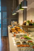 a buffet line with many plates of food on it at Hotel Bellevue Dubrovnik in Dubrovnik