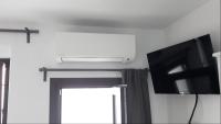 Televízia a/alebo spoločenská miestnosť v ubytovaní Puerta Alameda Suites Mirador Centro Historico