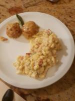 a white plate with food on a table at Agriturismo Fattoria Dalcastagnè in Torcegno
