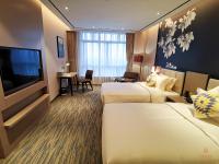 GHIC The Mulian Hotel of Bio-island Guangzhouにあるテレビまたはエンターテインメントセンター