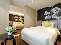 GHIC The Mulian Hotel of Bio-island Guangzhouにあるベッド