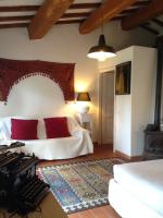 A bed or beds in a room at At Home In Maremma