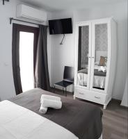 Posteľ alebo postele v izbe v ubytovaní Puerta Alameda Suites Mirador Centro Historico