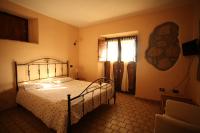 Posteľ alebo postele v izbe v ubytovaní Agriturismo Nociquerceto