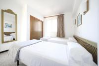Łóżko lub łóżka w pokoju w obiekcie Aparthotel Niu d´Aus