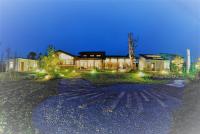 a house with lights in front of it at night at TFG B&amp;B in Lugu Lake