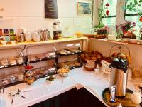 a counter with many different types of food on it at Pension Karina Schwerin in Schwerin