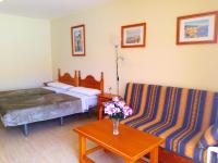 Łóżko lub łóżka w pokoju w obiekcie Apartamentos Parque Carolina