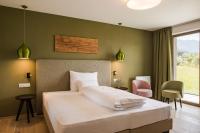 Posteľ alebo postele v izbe v ubytovaní Oliven- & Genusshotel Hirzer