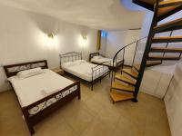 Posteľ alebo postele v izbe v ubytovaní Sahas Apartments