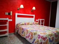 Postel nebo postele na pokoji v ubytování Hotel Doña Carmen