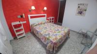 Postel nebo postele na pokoji v ubytování Hotel Doña Carmen