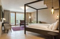 Posteľ alebo postele v izbe v ubytovaní Oliven- & Genusshotel Hirzer