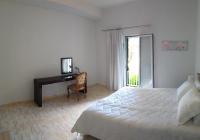 A bed or beds in a room at GEOMAR HOUSE 2 SKY AND VIEW