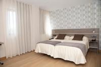 Postel nebo postele na pokoji v ubytování Hotel Mercedes