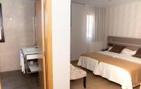 Postel nebo postele na pokoji v ubytování Hotel Mercedes