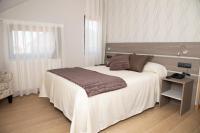 Postel nebo postele na pokoji v ubytování Hotel Mercedes