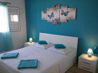 Postel nebo postele na pokoji v ubytování Apartmani PISAC