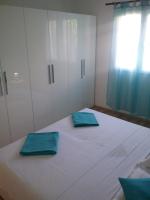 Postel nebo postele na pokoji v ubytování Apartmani PISAC