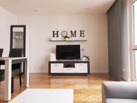 Televízia a/alebo spoločenská miestnosť v ubytovaní Apartament Kamienna Gdynia