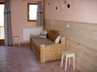a bedroom with a wooden bed in a room at BOROT2 in Lanslebourg-Mont-Cenis