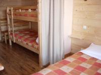 a bedroom with two bunk beds in a cabin at BOROT2 in Lanslebourg-Mont-Cenis