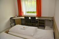 Postel nebo postele na pokoji v ubytování Hotel Wilhelmshöhe