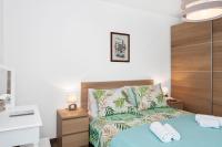 Posteľ alebo postele v izbe v ubytovaní Comfortable 3-Bedroom Apartment with Balcony and Fast Wi-Fi - 10 Minutes from Old Town