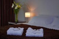 San Isidro Plaza Hotelにあるベッド