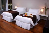 San Isidro Plaza Hotelにあるベッド