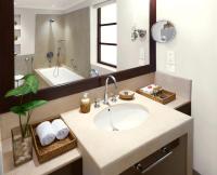 a bathroom with a sink and a large mirror at Taj Holiday Village Resort & Spa, Goa in Candolim