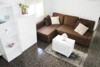 A seating area at Shiny Per Family Apartment
