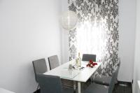 A seating area at Shiny Per Family Apartment