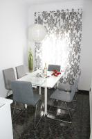 A seating area at Shiny Per Family Apartment