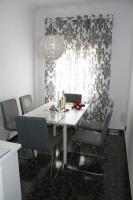 A seating area at Shiny Per Family Apartment