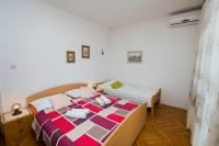 Postel nebo postele na pokoji v ubytování Apartment Zlatko