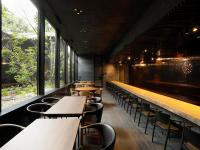 a row of tables and chairs in a restaurant at Sowaka in Kyoto