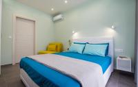 Posteľ alebo postele v izbe v ubytovaní Passas Inn Luxury Living