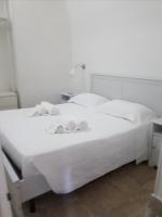 A bed or beds in a room at La Rosa dei Sassi 2
