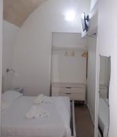 A bed or beds in a room at La Rosa dei Sassi 2