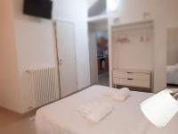 A bed or beds in a room at La Rosa dei Sassi 2