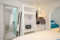 Posteľ alebo postele v izbe v ubytovaní Naxos Evilion Luxury Apartments & Suites