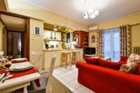 Televízia a/alebo spoločenská miestnosť v ubytovaní Star Parthenon Apartment