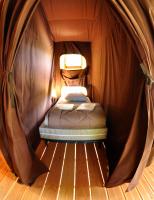 Un ou plusieurs lits dans un h&eacute;bergement de l&#39;&eacute;tablissement Camping les Princes d&#39;Orange