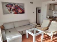 Posezení v ubytování ISLA CANELA URBANIZACION ALCAUDON APARTAMENTO 50M PLAYA