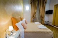Posteľ alebo postele v izbe v ubytovaní La Locandiera B&B