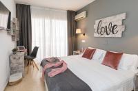 Postel nebo postele na pokoji v ubytování Hotel Bulevard
