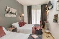 Postel nebo postele na pokoji v ubytování Hotel Bulevard
